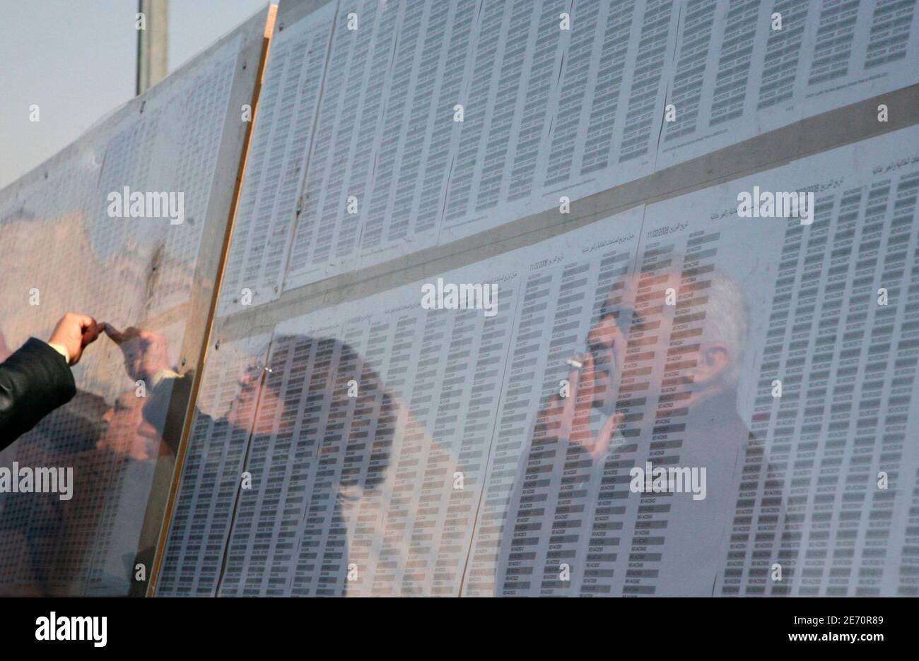 Iraqi Refugees Check Their Names On An Assistance List Posted By 