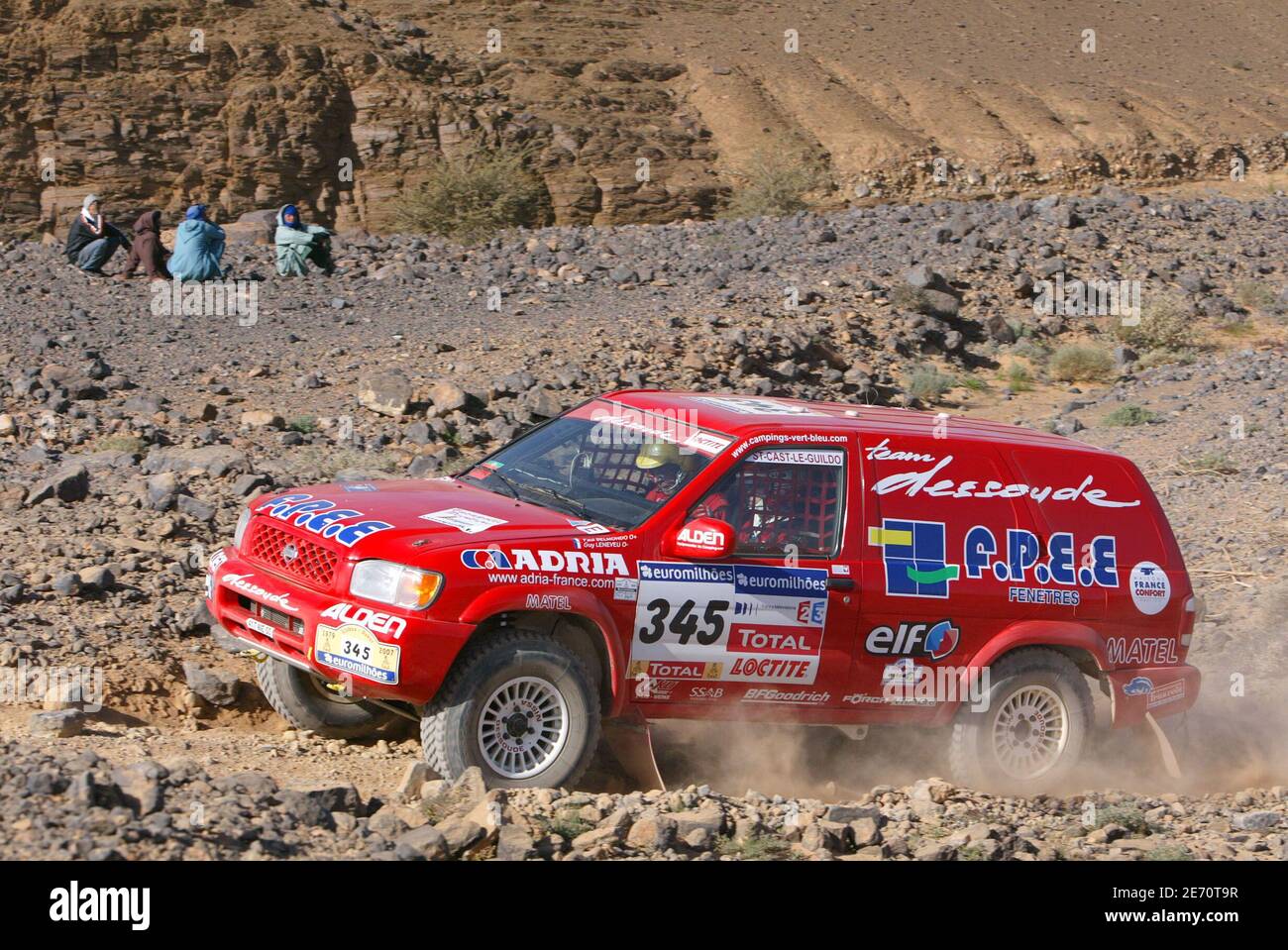 France's Paul Belmondo drives his Nissan Pathfinde in the desert at the ...