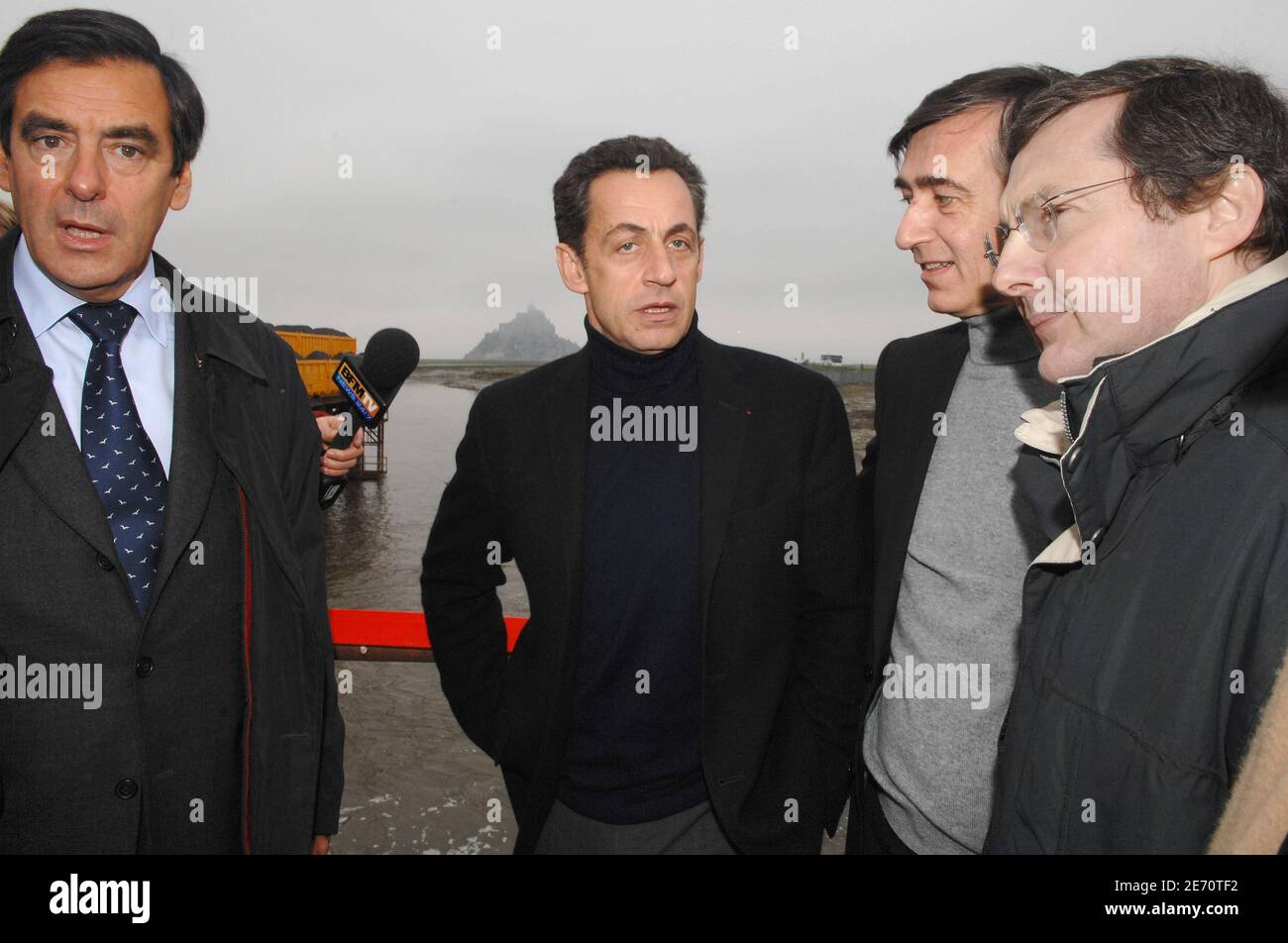 French Interior minister Nicolas Sarkozy, freshly appointed as the right's candidate in April's French presidential election, accompanied by political advisor Francois Fillon (L), Foreign Affaires minister Philippe Douste-Blazy and Social Security minister Philippe Bas, visit the Mont-Saint-Michel, France, on January 15, 2007. Photo by Christophe Guibbaud/ABACAPRESS.COM Stock Photo