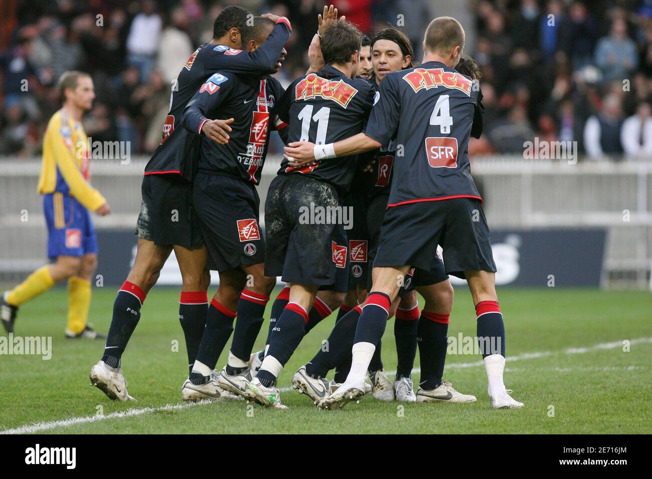 Psg's Bonaventure Kalou and coach Guy Lacombe during the UEFA Cup football  match Paris Saint-Germain vs Panathinaikos at the Parc des Princes in  Paris, France on December 13, 2006. Psg won 4-0.