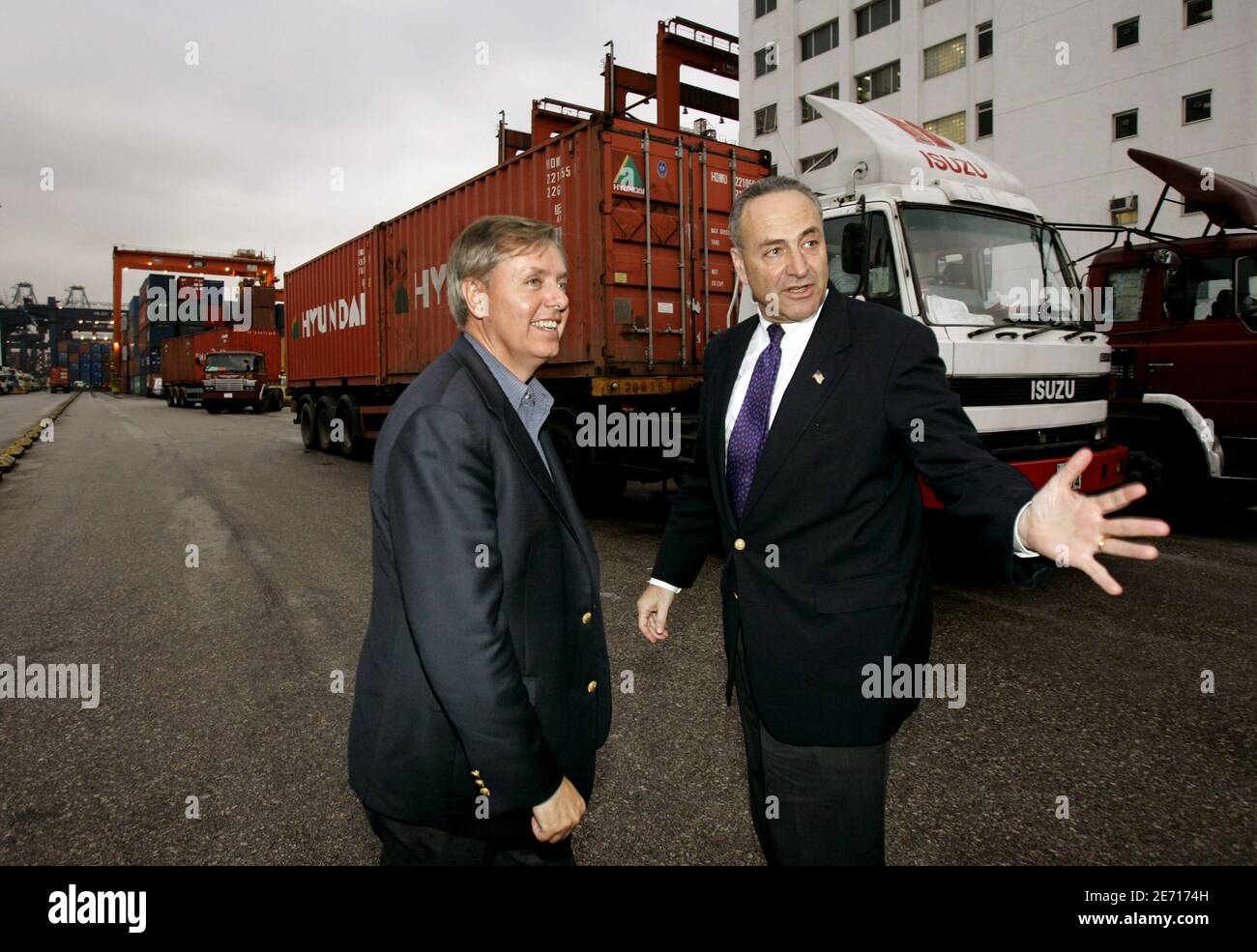 U.S. Senators Charles Schumer (R) of New York and Lindsey Graham of South Carolina visit a Hutchison International container port in Hong Kong March 25, 2006. In the aftermath of the Dubai ports dispute, the Bush administration is negotiating with Hong Kong-based Hutchison Whampoa Ltd on a contract involving nuclear detection devices at Freeport, Bahamas, that would monitor cargo passing through to the United States.  REUTERS/Kin Cheung/Pool Stock Photo
