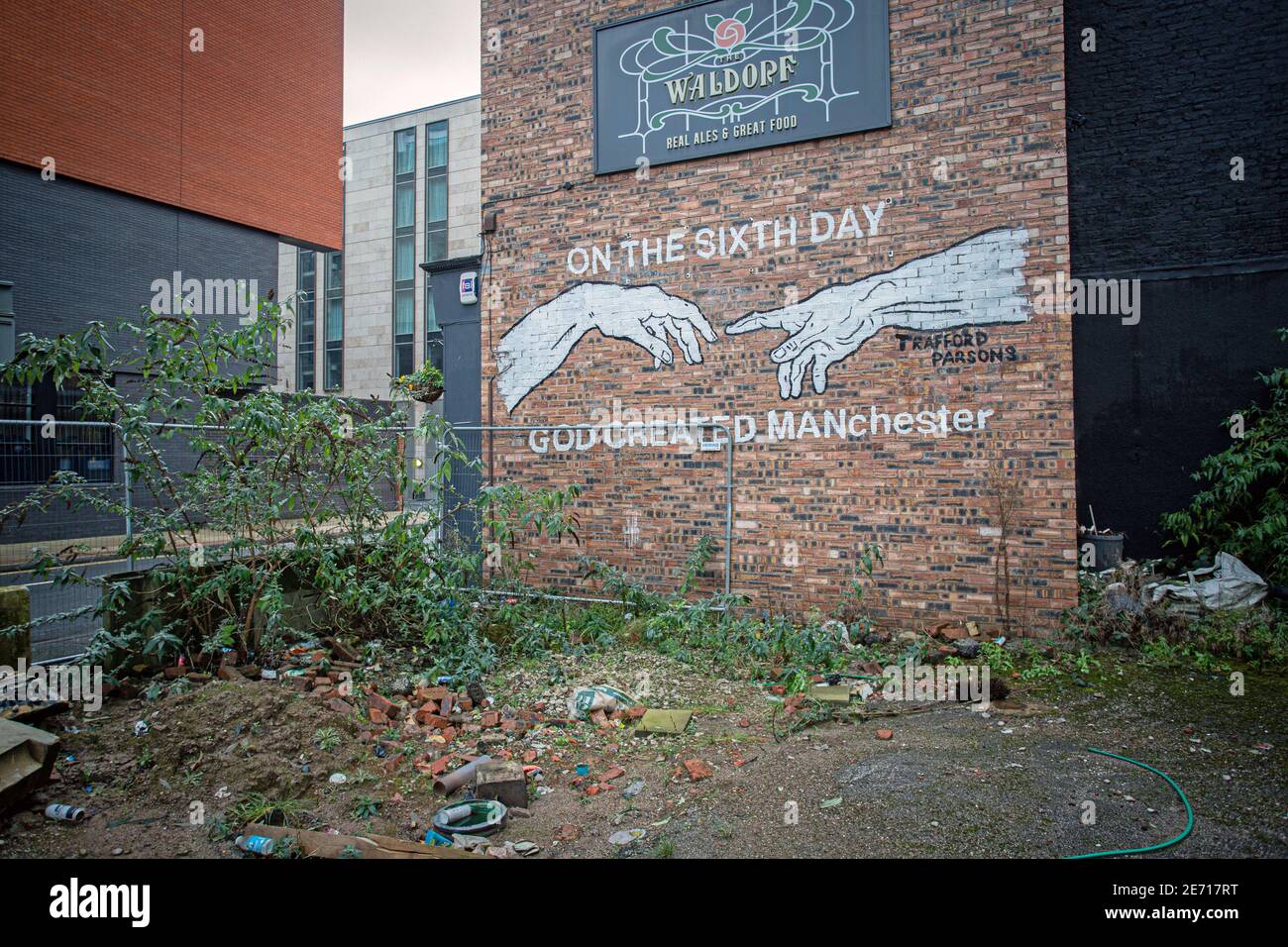 Mural on Pub wall : On the sixth day god created manchester ,Manchester, Uk Stock Photo