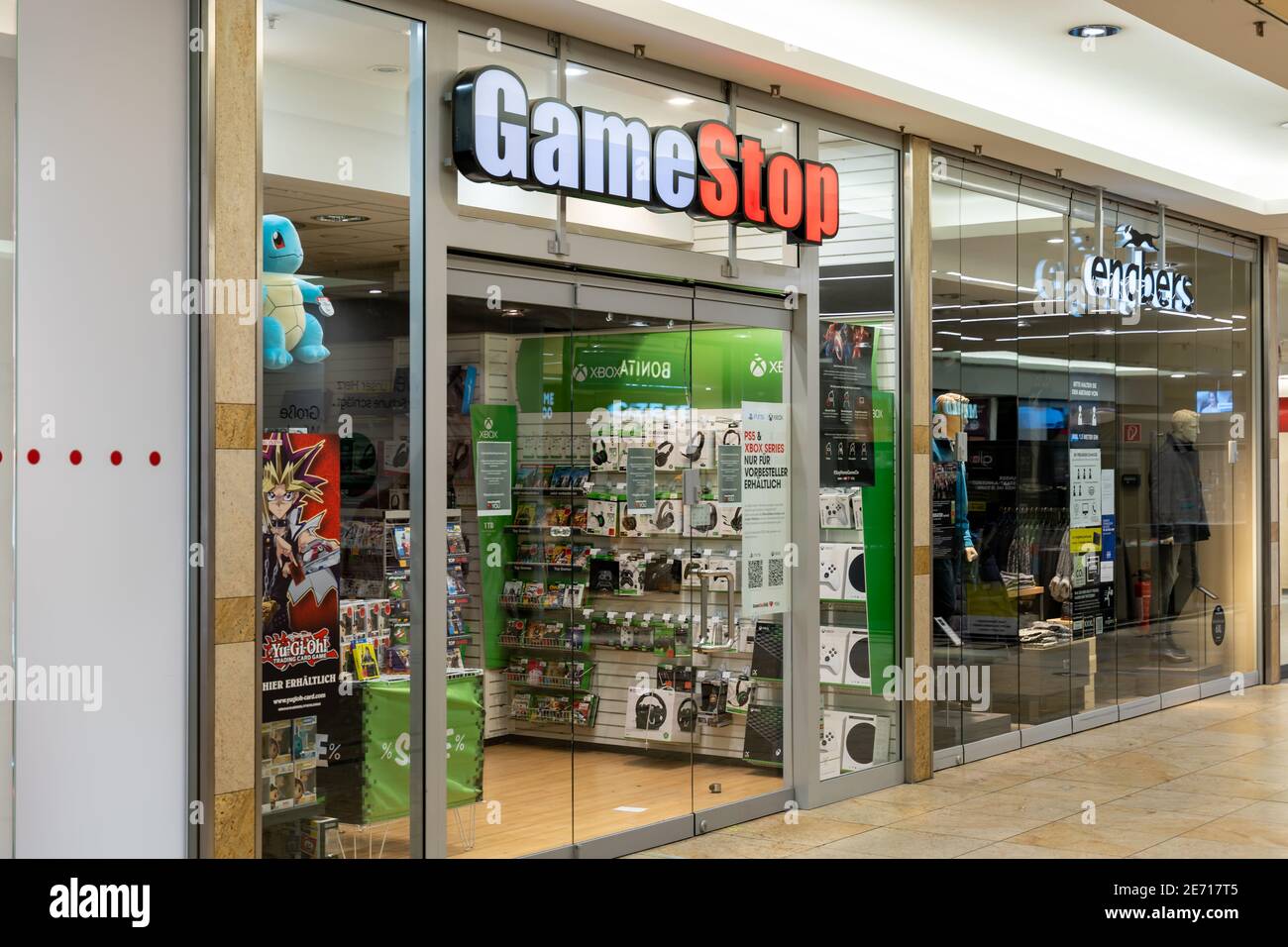 GameStop store front in a shopping center. Big illuminated logo shining