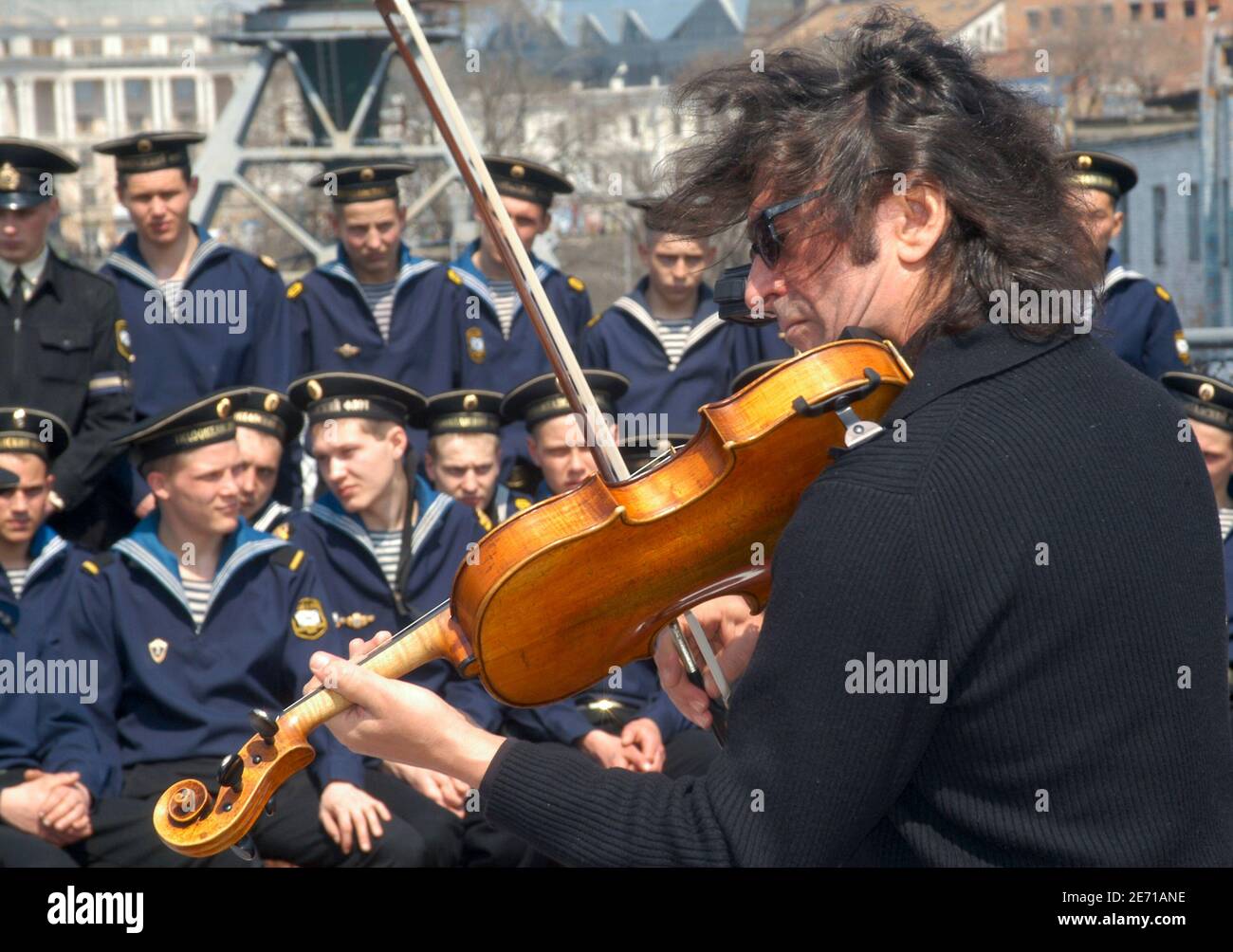 Russian viola-player Yuri Bashmet performs with his orchestra ' The Moscow  Soloists' in honour of the late former Russian President Boris Yeltsin in  front of sailors from the destroyer 'Admiral Tributs' in