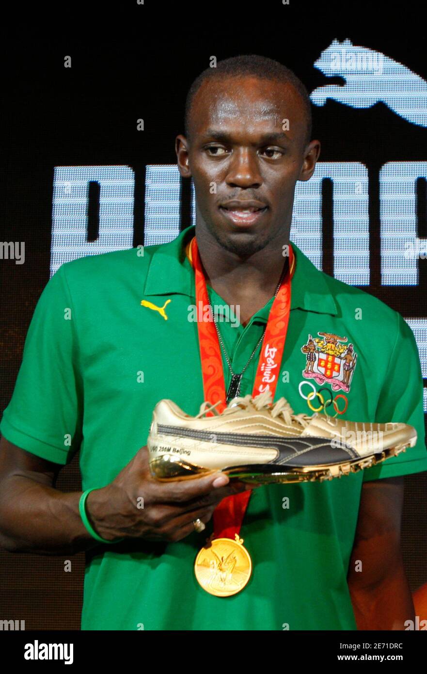 Usain Bolt of Jamaica shows his Puma shoes during a news conference in  Beijing August 23, 2008 REUTERS/Gil Cohen Magen (CHINA Stock Photo - Alamy