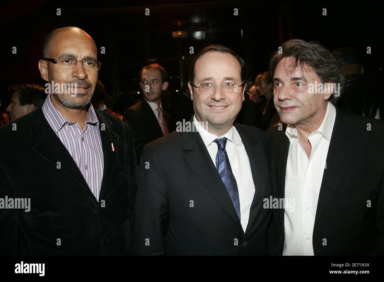 Harlem Desir, Francois Hollande and Yves Simon attend the annual dinner for godmothers and godfathers of French anti-racism association 'SOS Racisme' held at the Cabaret Sauvage in Paris, France on january 29, 2007. Photo by Mousse/ABACAPRESS.COM Stock Photo
