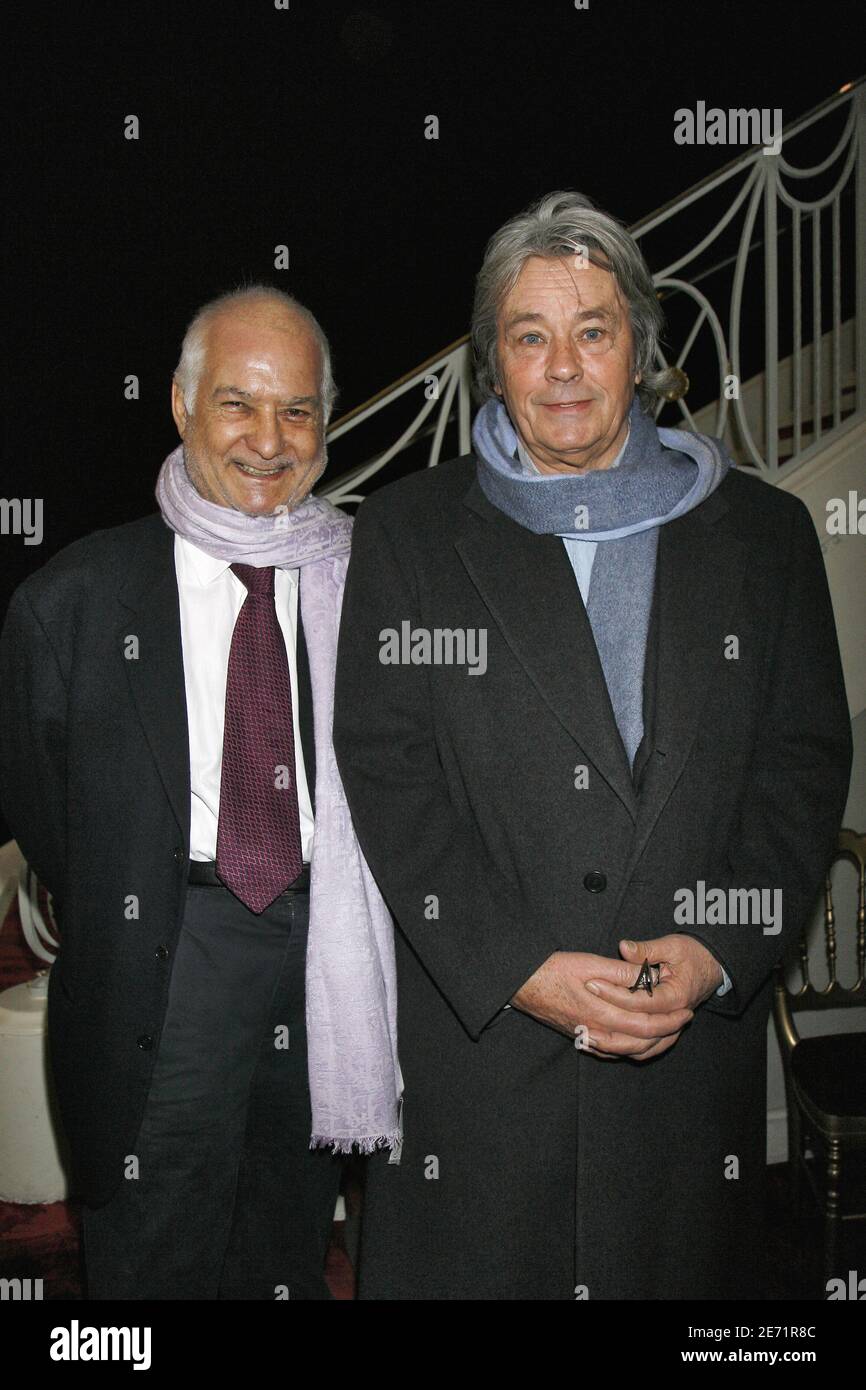 Jean-Claude Brialy and Alain Delon at the unveilling of a photography of  Ingrid Betancourt on the front of 'Le theatre Marigny' by Paris Mayor  Bertrand Delanoe, in Paris, France, on February 1,