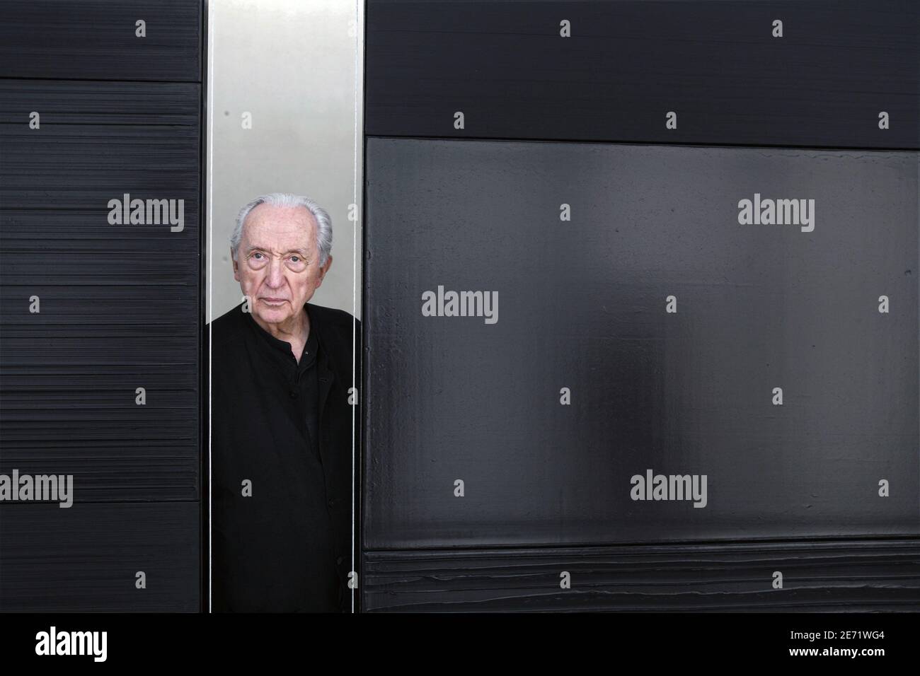 Famous painter Pierre Soulages poses in front of some of his canvas in the hall dedicated to his masterpieces in the new museum Fabre opened in the city of Montpellier, South of France on February 2, 2007. Photo by Pascal Parrot/ABACAPRESS.COM Stock Photo