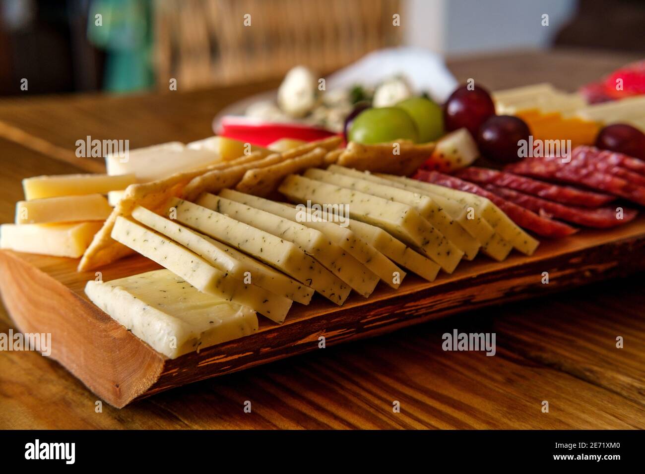 Italian charcuterie board featuring crackers cheese and salami served
