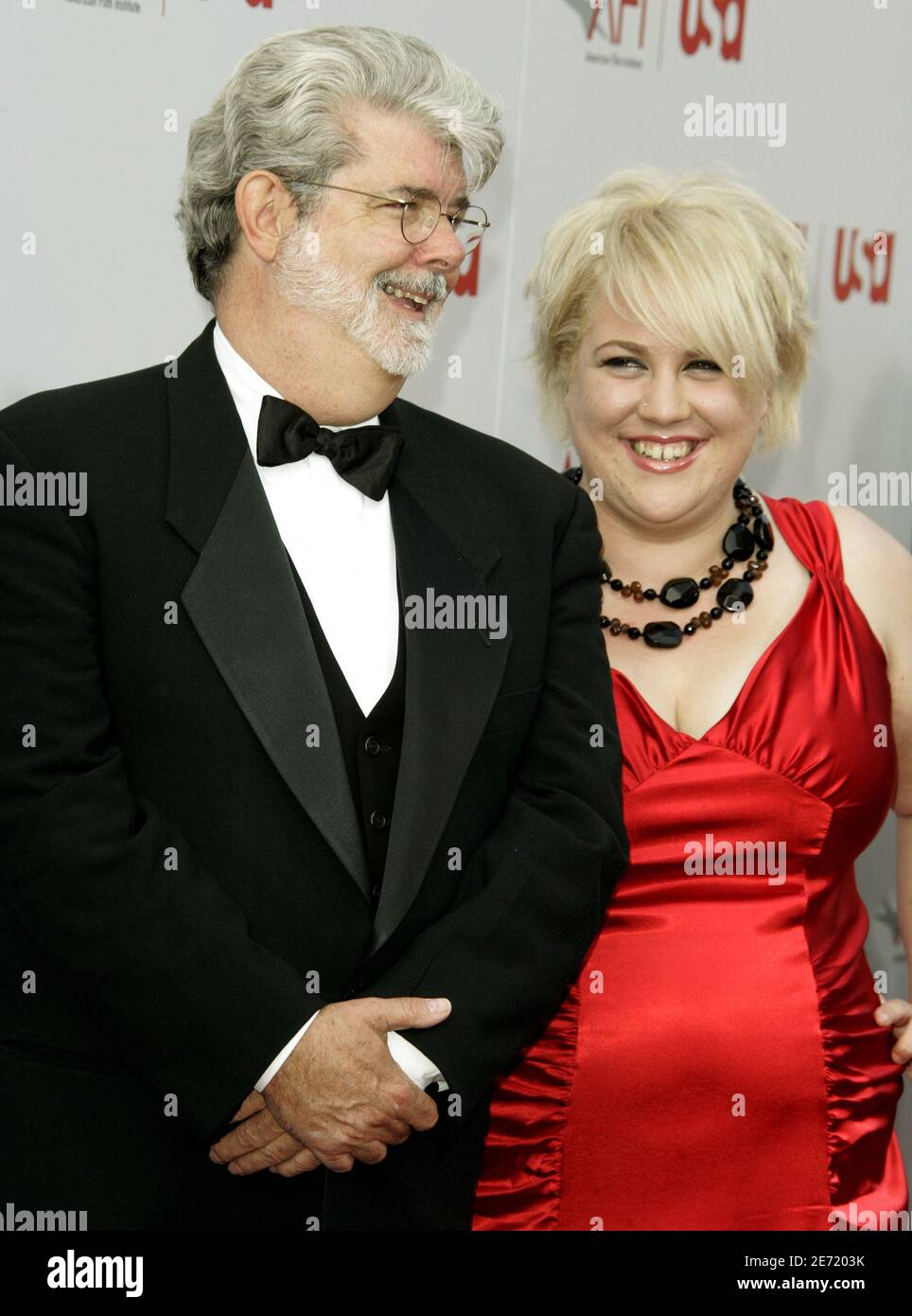 Director George Lucas (L) and daughter Katie pose as they arrive at the American Film Institute's 'AFI Life Achievement Award, A Tribute to Sir Sean Connery'  taping in Hollywood June 8, 2006. Stock Photo