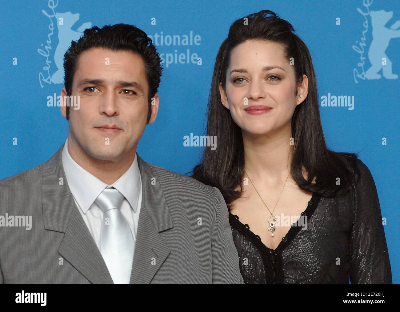 French actors Marion Cotillard and Jean-Pierre Martins poses for  photographers during a photocall for the movie 'La Mome' at the 57th  International Berlin Film Festival in Berlin, Germany, on February 8, 2007.