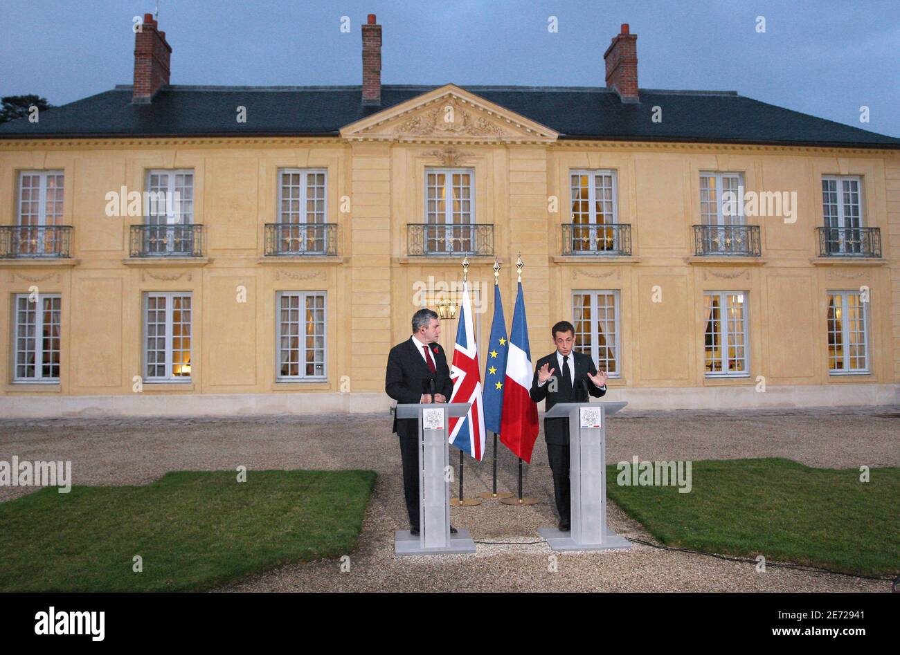 France's President Nicolas Sarkozy (R) delivers a speech near Britain's  Prime Minister Gordon Brown at the presidential residence at La Lanterne,  in an estate associated with the Chateau de Versailles southwest of