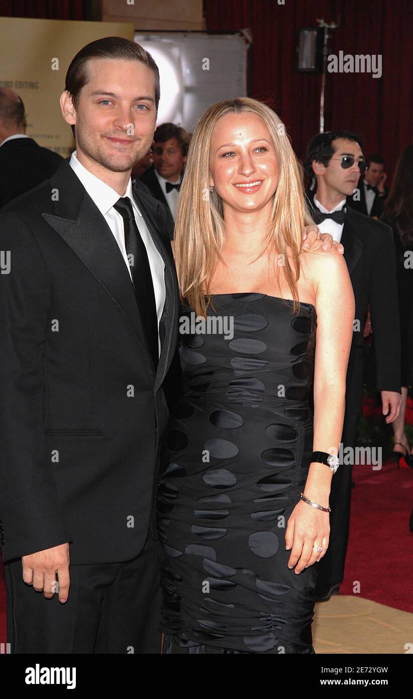 Tobey Maguire and Jennifer Meyer arrive at the 79th Academy Awards held ...