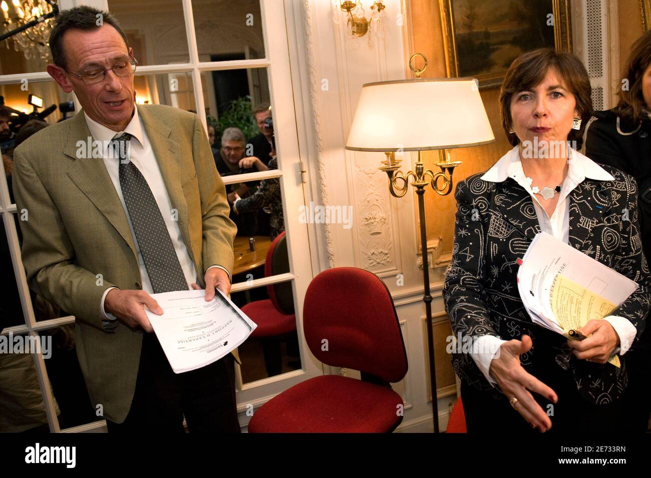 Marie-Christine Chastant-Morand (R) and Thierry Moser, lawyers of Christine  and Jean-Marie Villemin, parents of murdered 4-year-old Gregory, speak to  the media after a news conference in Paris October 22, 2009 about the