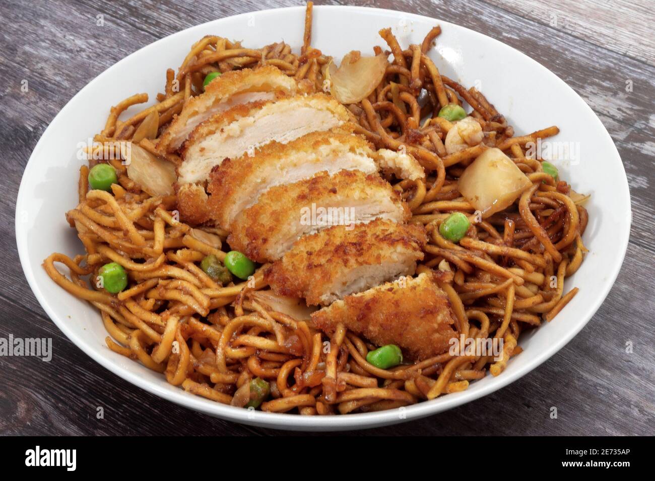 Chicken katsu with teriyaki noodles Stock Photo Alamy