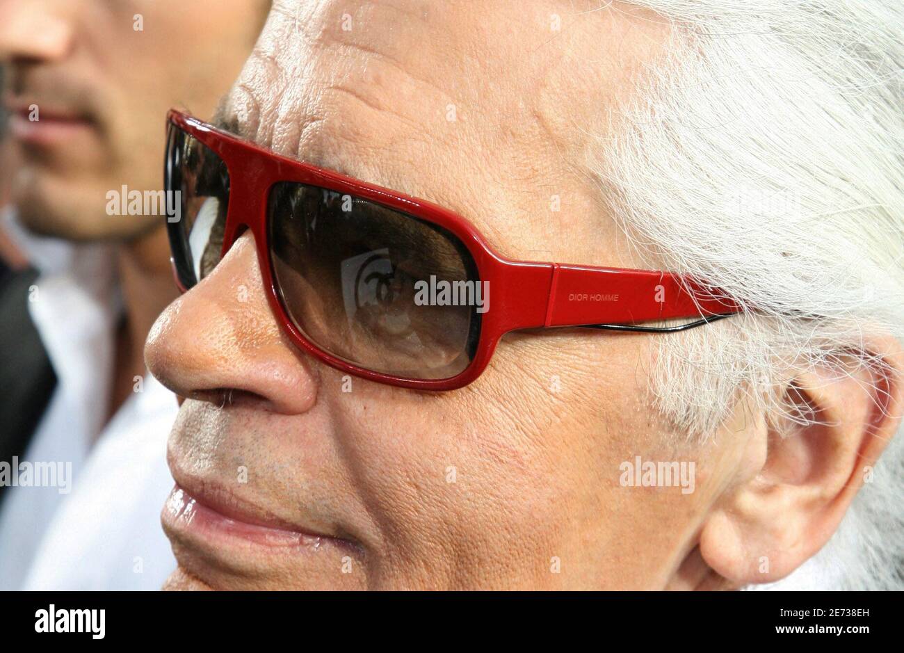Designer Karl Lagerfeld, wearing Dior men sunglasses, is surrounded by  international media at the end of the Chanel Fall-Winter 2007-2008  Ready-to-Wear collection show held at the Grand Palais in Paris, France on
