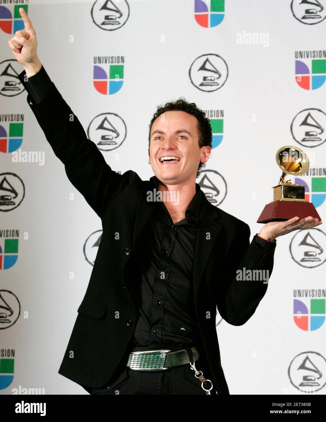 Juan Fernando Fonseca holds his award for Best Tropical Song with 