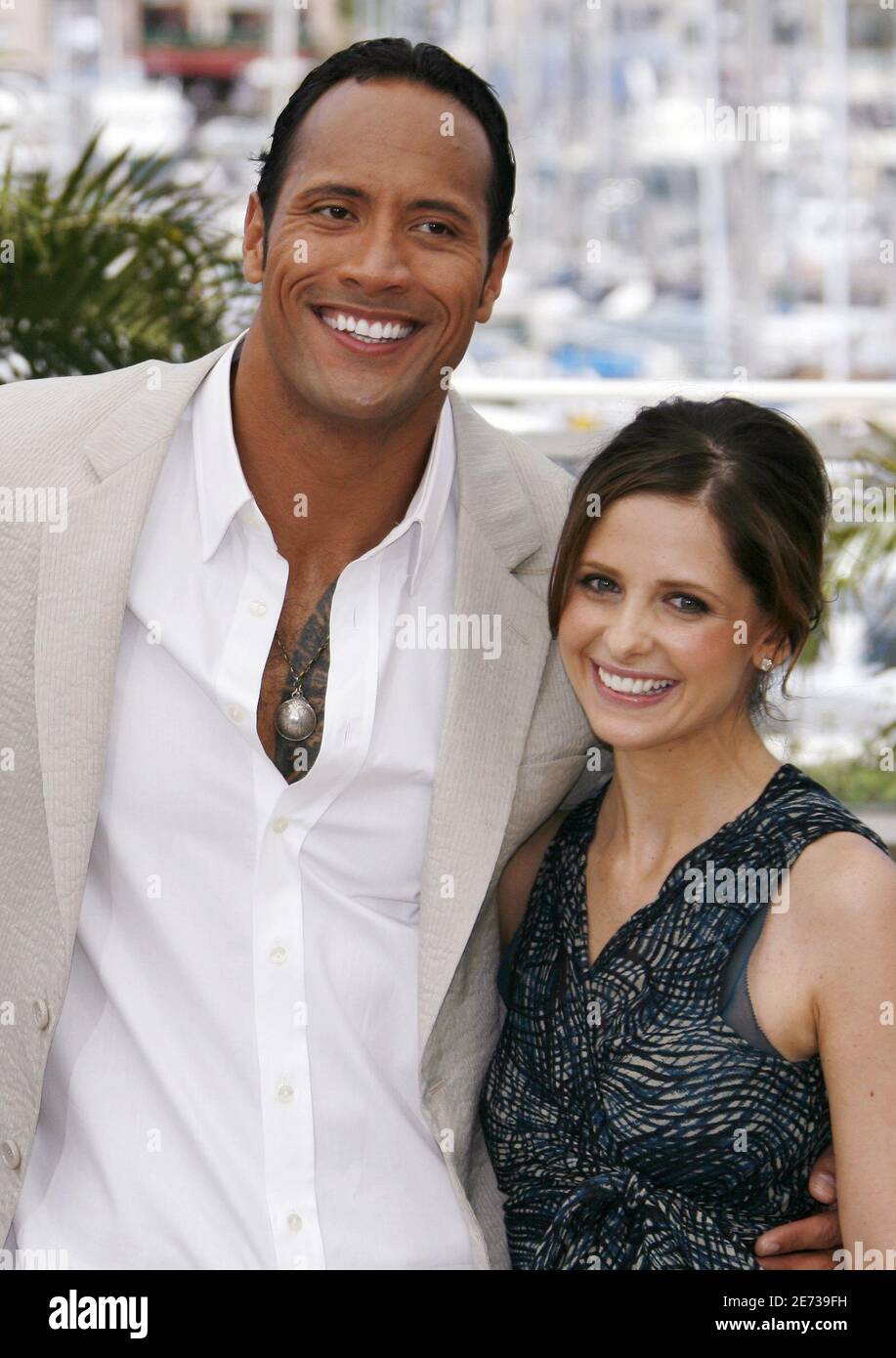 Cast members Dwayne 'The Rock' Johnson (L) and U.S. actress Sarah Michelle Gellar attend a photocall for [U.S. director Richard Kelly's] in-competition film 'Southland Tales' at the 59th Cannes Film Festival, May 21, 2006. Stock Photo