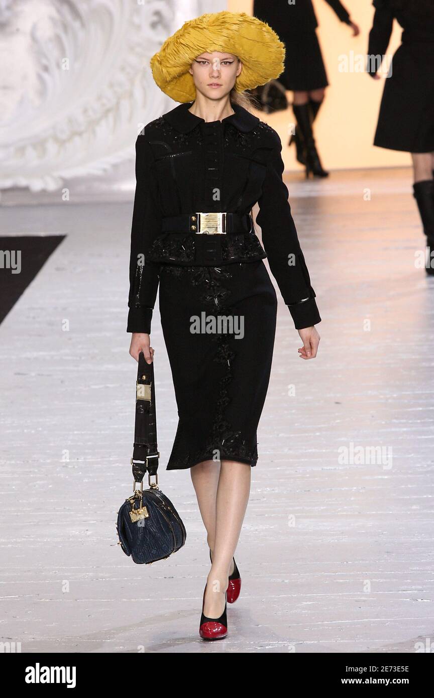 A model displays a creation by designer Marc Jacobs for the Louis Vuitton  Fall-Winter 2007-2008 Ready-To-Wear collection presentation, held at the '  Cour carree du louvre', in Paris, France, on March 4