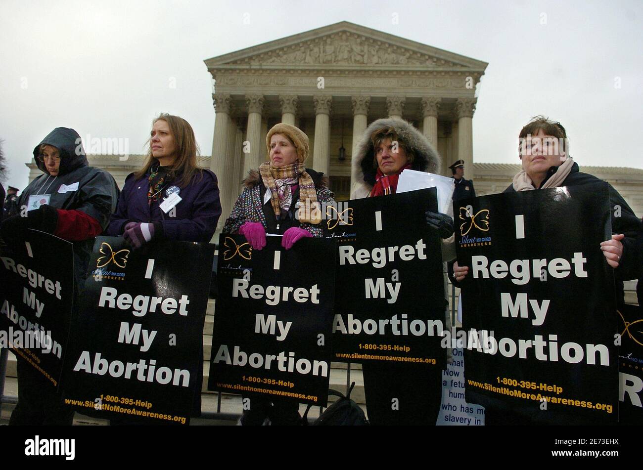 Pro-life demonstrators listen to speakers as they stand in front of the US Supreme Court to mark the 35th anniversary of Roe vs Wade, the landmark legislation which allowed abortion rights, during a rally in Washington January 22, 2008.      REUTERS/Mike Theiler  (UNITED STATES) Stock Photo