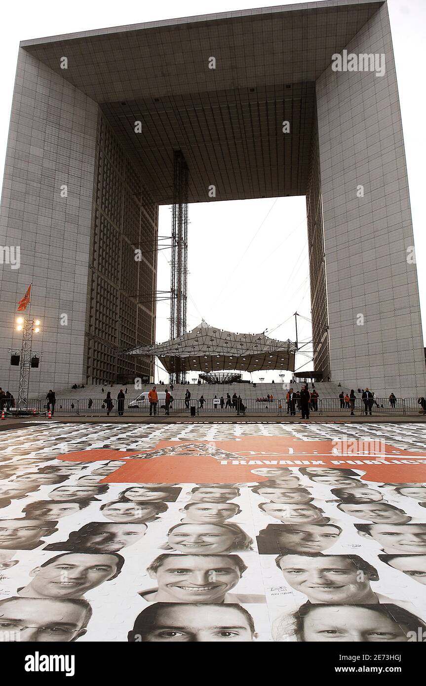 A giant puzzle (10000 pieces) was installed outside the Arch of La Defense  near Paris, France on March 7, 2007 to promote the employment of 10000  young workers in the sector of