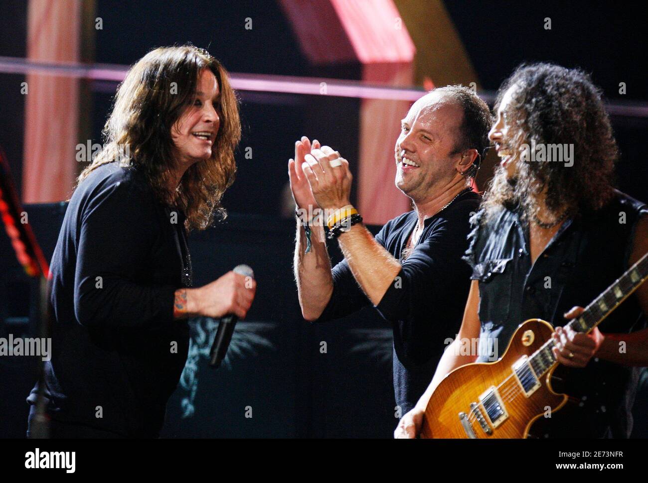 Lars Ulrich (C) and Kirk Hammett (R) of the band Metallica smile after  performing with Ozzy Osbourne (L) during the second of two 25th Anniversary  Rock & Roll Hall of Fame concerts