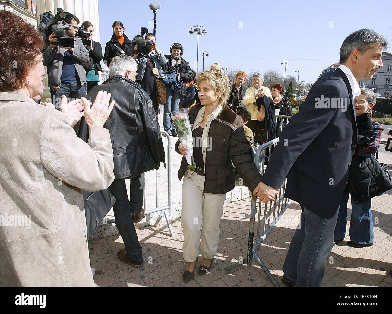 Nurse Chantal Chanel leaving with her husband the Perigueux court, South west of France on March 15, 2007. Doctor Laurence Tramois and nurse Chantal Chanel are accused of euthanesia, done on a woman who was sufferering of a cancer in terminal stage. According to French laws, Tramois and Chanel are convicted of 'poisonning' and 'participation of poisoning'. Chantal Chanel is accused to have given the lethal injection of potassium to thef 65 years woman in the hospital of Saint-Astier (Dordogne). Both can be condemned to a maximum sentence of 30 years in jail. They are waiting the sentence durin Stock Photo