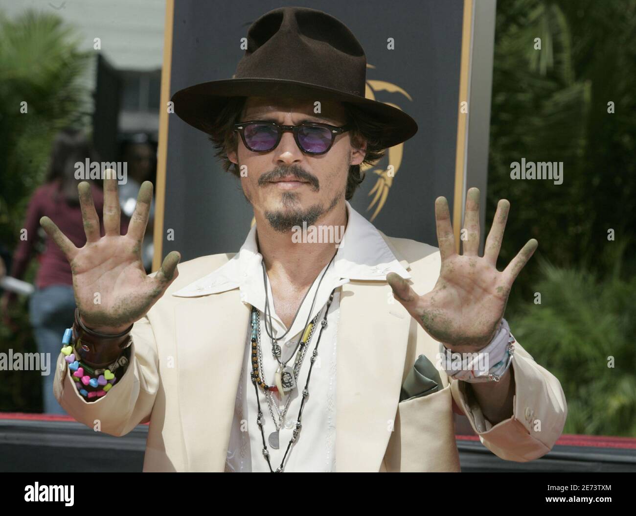 Actor Johnny Depp shows off his hands after leaving his handprints in cement in the forecourt of Grauman's Chinese Theatre in Hollywood September 16, 2005. Depp's voice is featured in the new Actor Johnny Depp shows off his hands after leaving his handprints in cement in the forecourt of Grauman's Chinese Theatre in Hollywood September 16, 2005. Depp's voice is featured in the new
