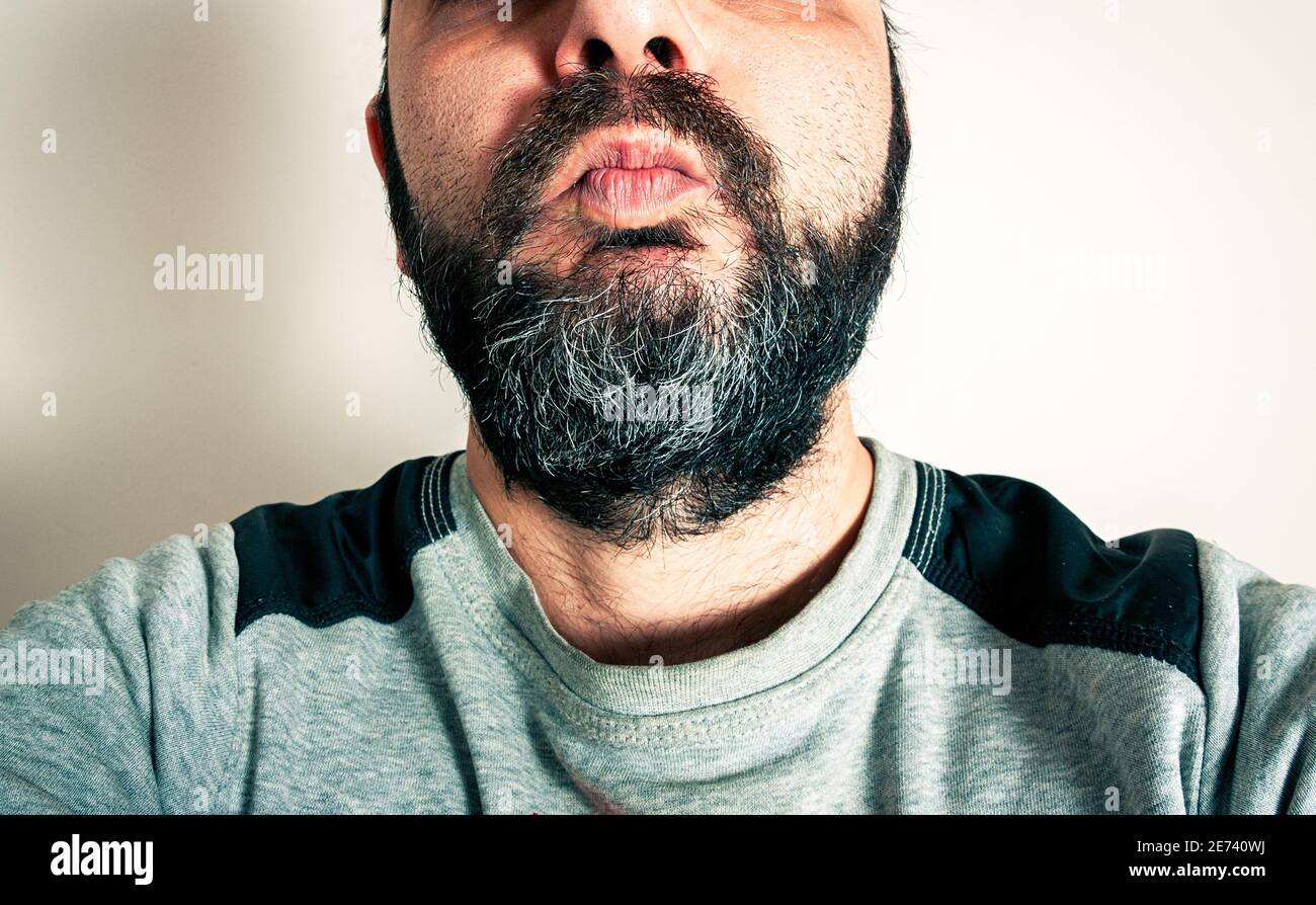 Funny man with the beard making expressions Stock Photo - Alamy