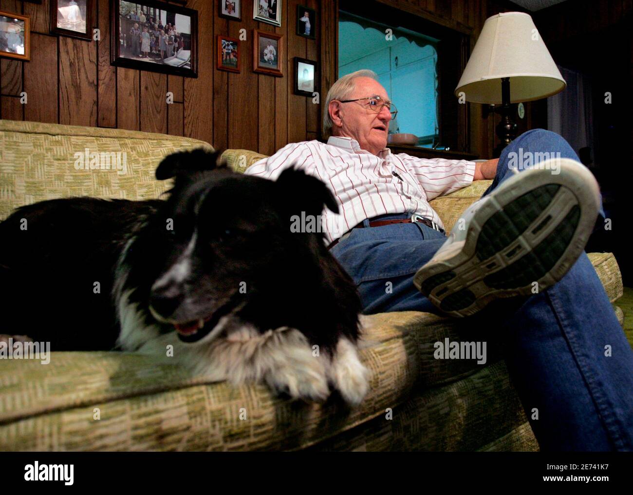 George Thomas Jones, a former businessman who now writes about local history, reminisces about author Harper Lee as he is pictured in Monroeville, Alabama with his dog Sissy in this May 17, 2007 file photo. Thousands of tourists come each spring to watch a stage adaptation of the book 'To Kill A Mockingbird' performed by unpaid local actors at old courthouse. When Lee wrote 'To Kill A Mockingbird', a novel about racial injustice in a southern town, she could not have known it would be hailed as a classic and enable her home town to learn from its own history. Historians have discovered that Le Stock Photo