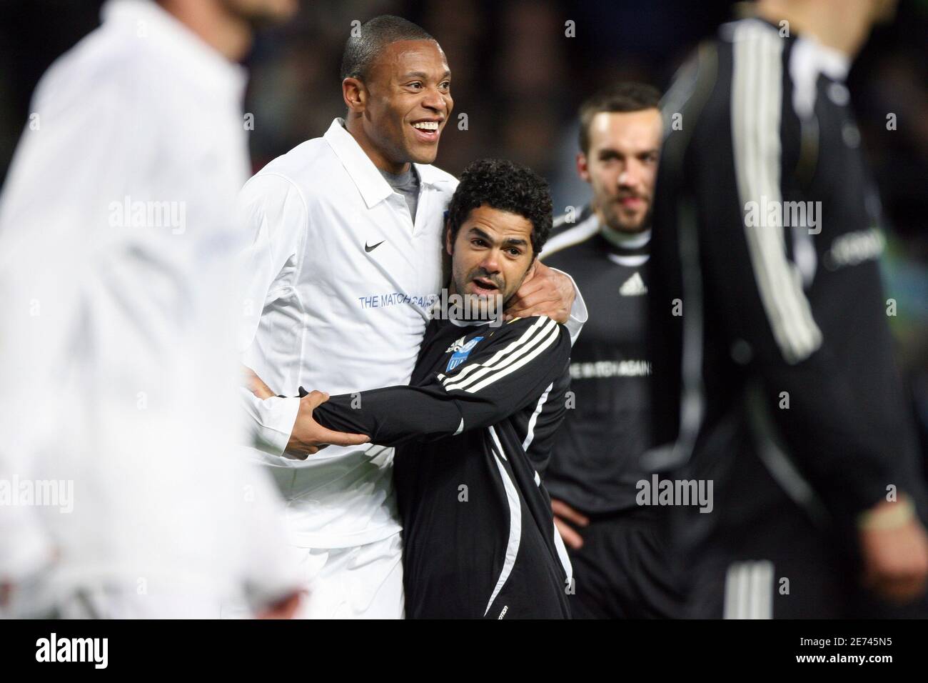 Julio Baptista and French humorist Jamel Debbouze fool around during the United Nations Development Program charity soccer match at the Velodrome stadium in Marseille, France on March 19, 2007. The Match Against Poverty aims for raise funds to fight poverty. Photo by Mehdi Taamallah/Cameleon/ABACAPRESS.COM Stock Photo