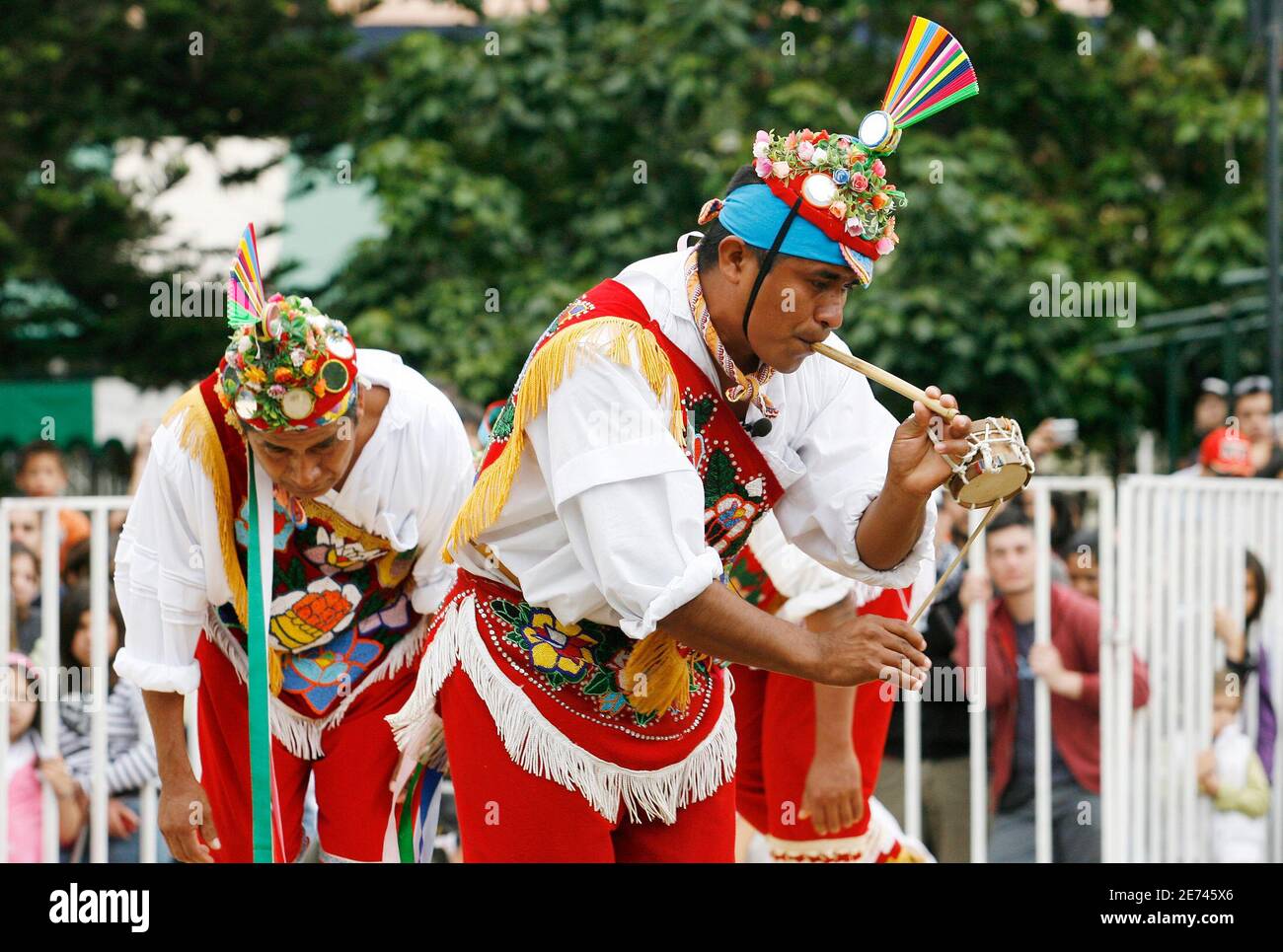 Men from Papantla, a village in Veracruz, Mexico, dance as they prepare to  perform the flying rope ritual, where they will descend by rope from a  30-foot-high (9-metre-high) wooden post, during the