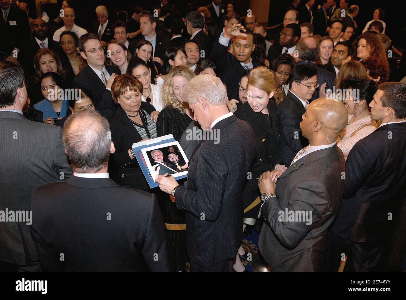 Former US President Bill Clinton signs autographs as he arrives at a fund-raising organised to help her wife, senator and Democratic presidential candidate Hillary Clinton, in Washington DC, USA on March 20, 2007. Photo by Olivier Douliery/ABACAPRESS.COM Stock Photo