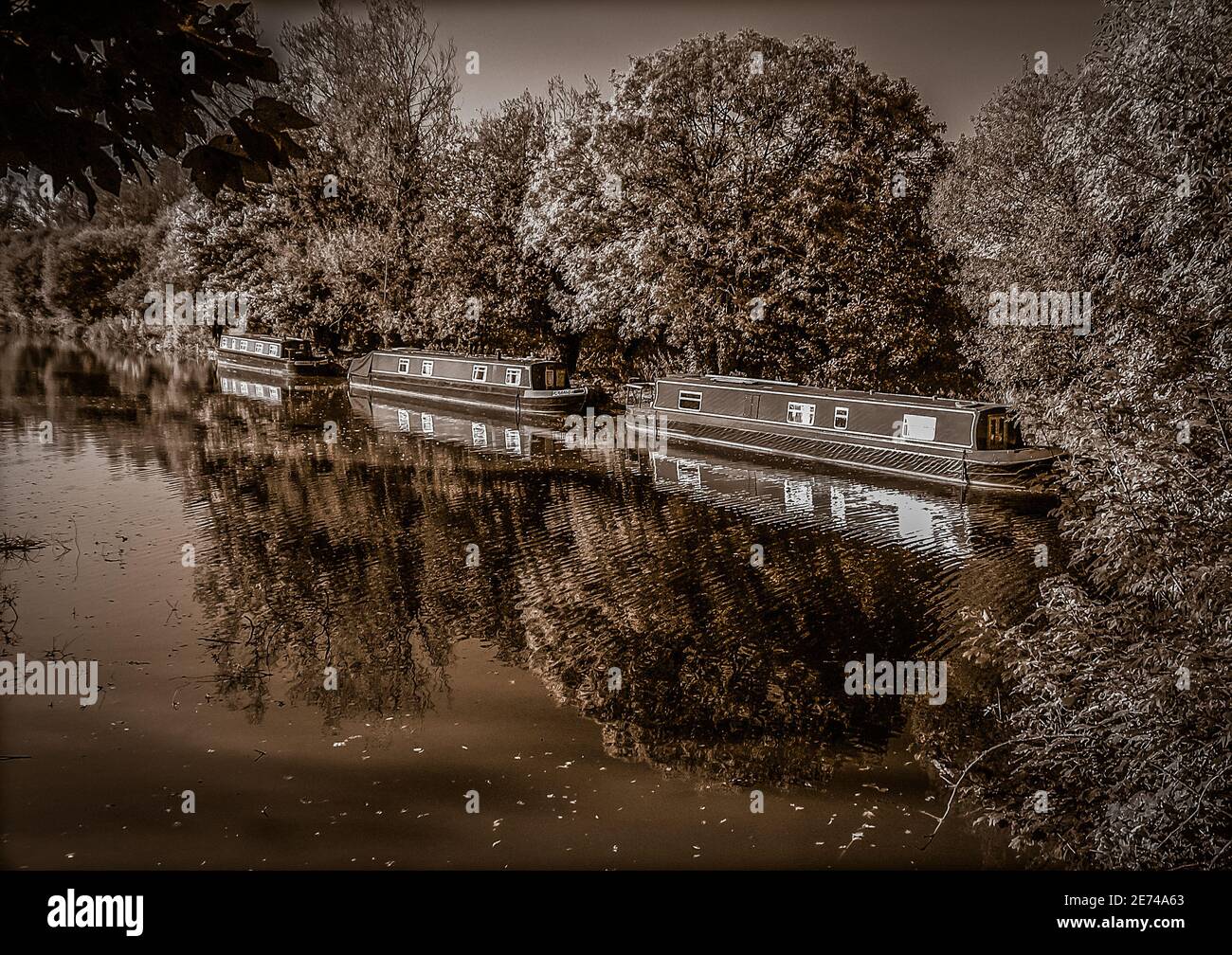 Canal boats moored up on the and Avon Canal at Kintbury lock in