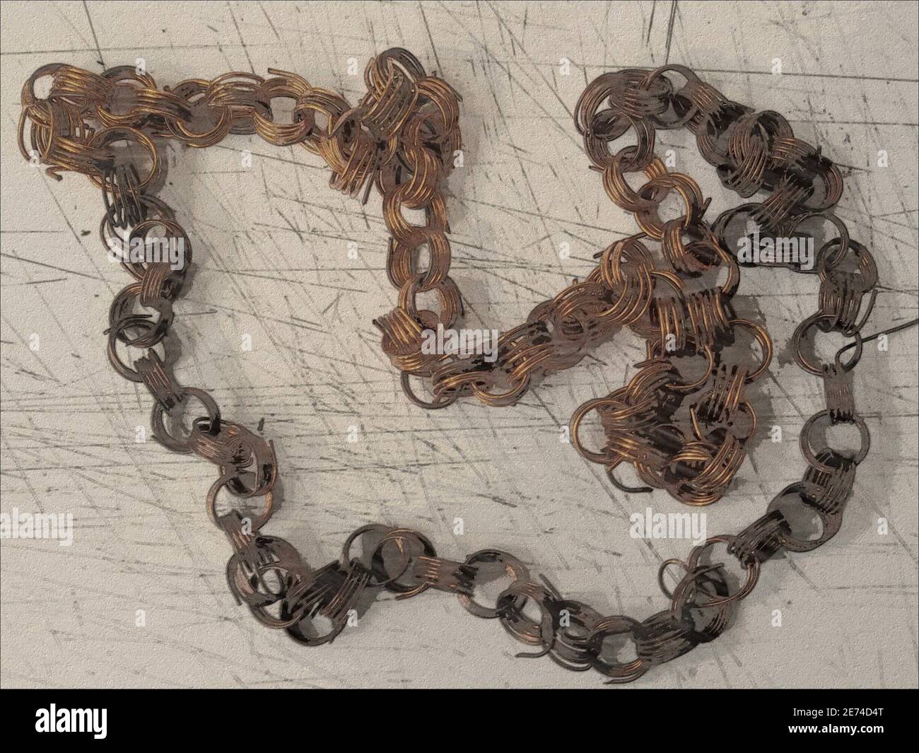 Surfaces with a twisted chain. Black and gray distress overlay ...