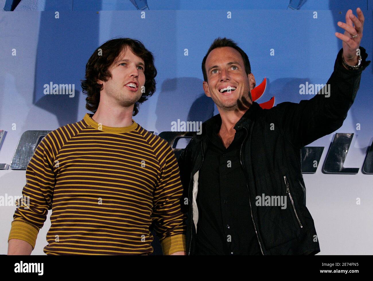 Actors Jon Heder (L) and Will Arnett joke around at a media opportunity at an ice skating rink to promote their film "Blades of Glory" in Sydney June 6, 2007.         REUTERS/Tim Wimborne     (AUSTRALIA) Stock Photo