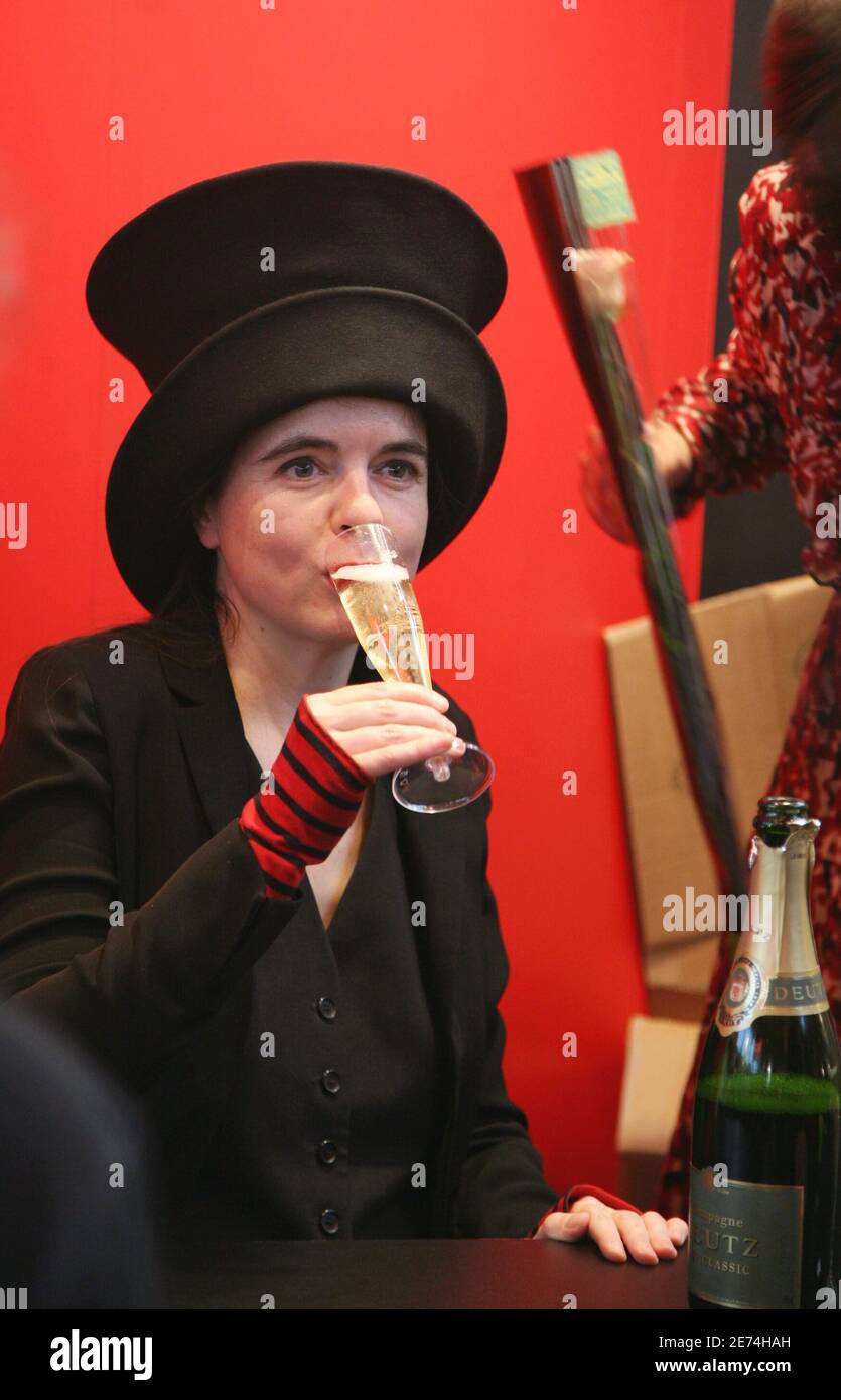Writer Amelie Nothomb drinks some champagne during the final day of Paris  Book Fair 'Le Salon Du Livre' held at Porte de Versailles in Paris, France,  on March 27, 2007. Photo by