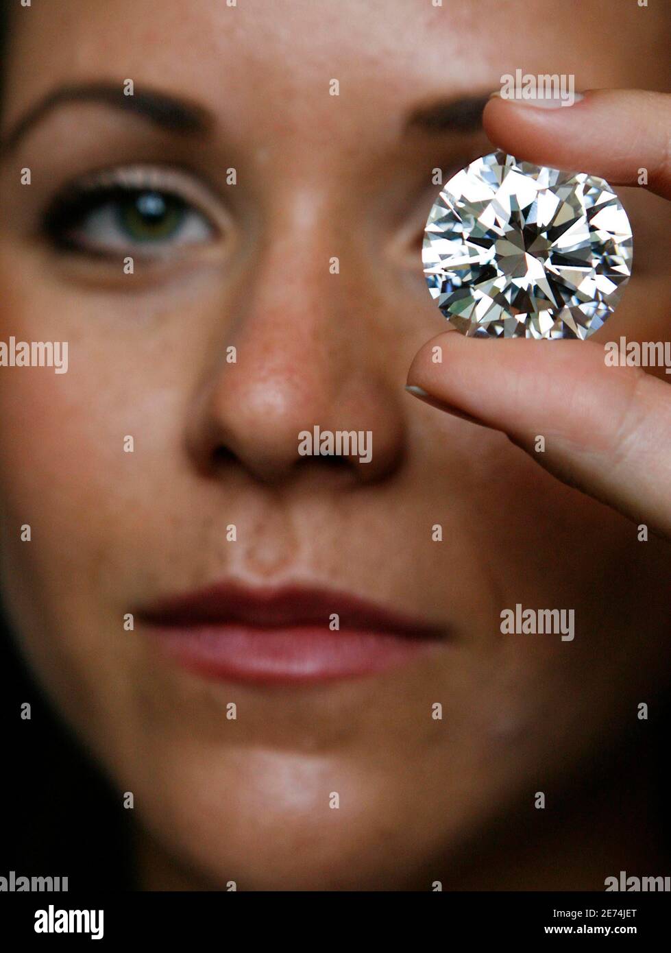 A Model Displays A Brilliant Cut D Color Flawless Diamond Weighing 84 37 Carats During A Preview At Sotheby S Auction House In Geneva October 1 07 The Diamond Which Is The Largest Brilliant Cut Diamond