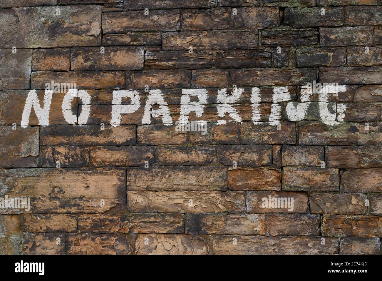 Hand drawn no parking sign in white paint Stock Photo