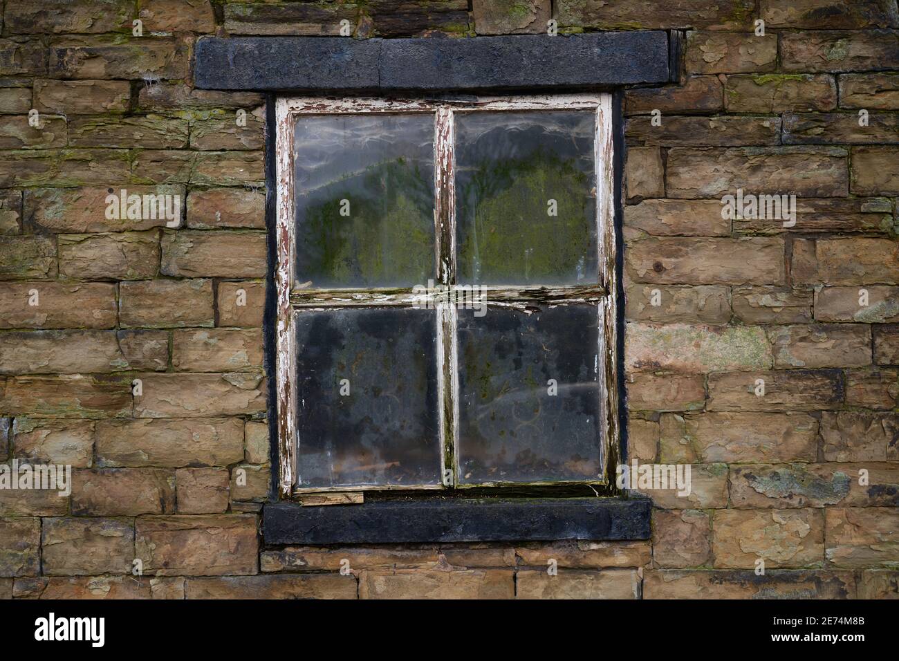 Old window frame taken at an old stone built farm in England, UK Stock Photo