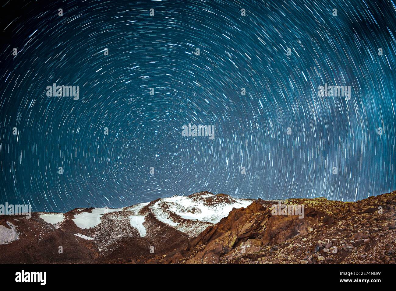 Peak of mount Damavand in Iran with star trails at night. Stock Photo