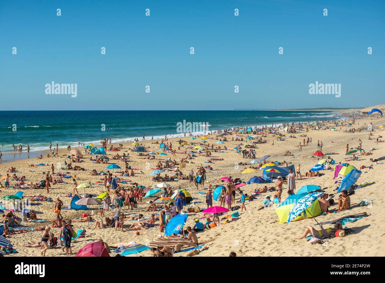 Crowded beach in Biscarrosse Plage, Nouvelle Aquitaine, France. Biscarrosse is an important holiday destination in the Landes, southwestern France Stock Photo