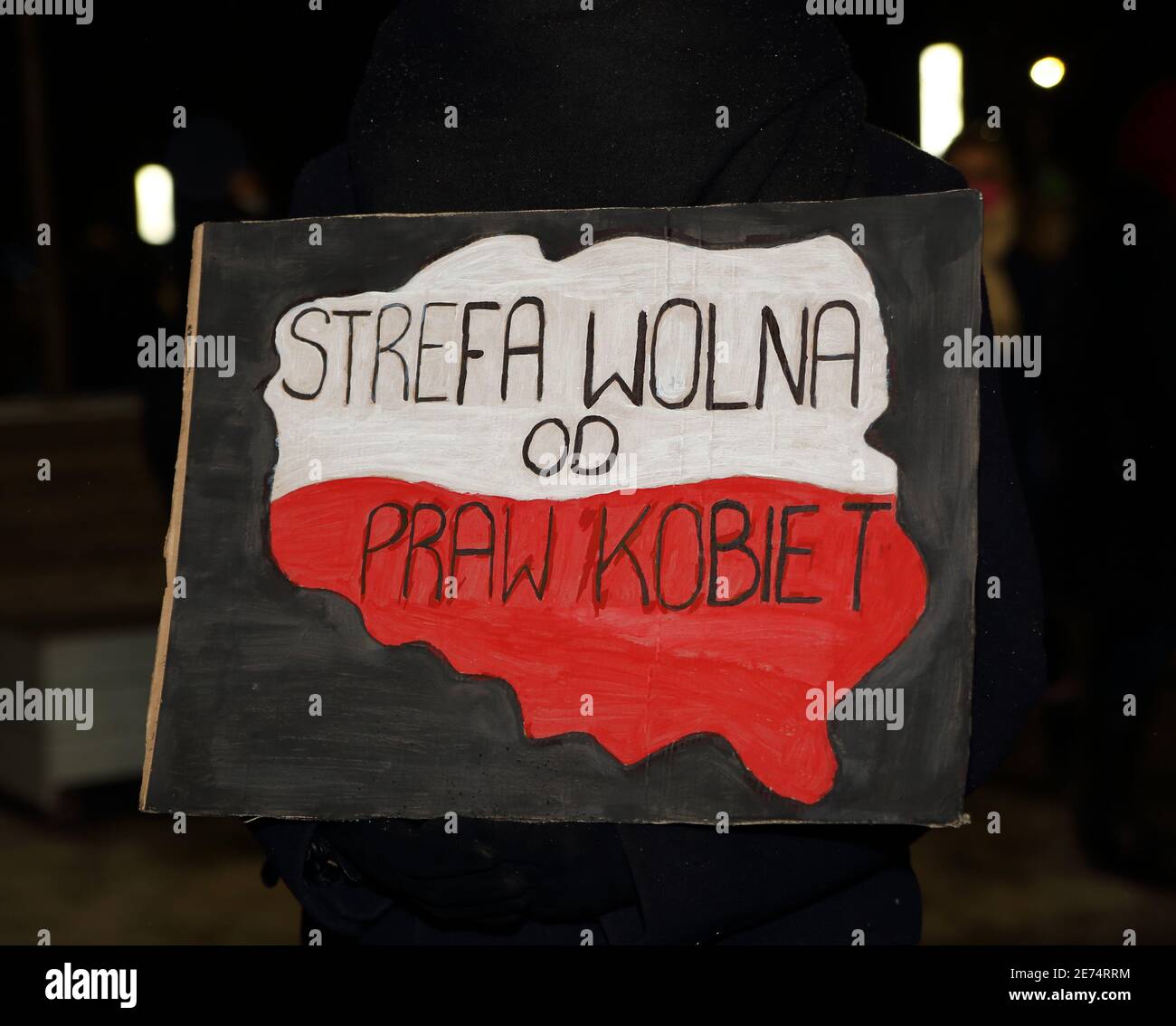 Krakow, Poland - January 29 2021: Banner with map of Poland painted in national colors and slogan ZONE FREE OF WOMEN RIGHTS, public protest. Stock Photo