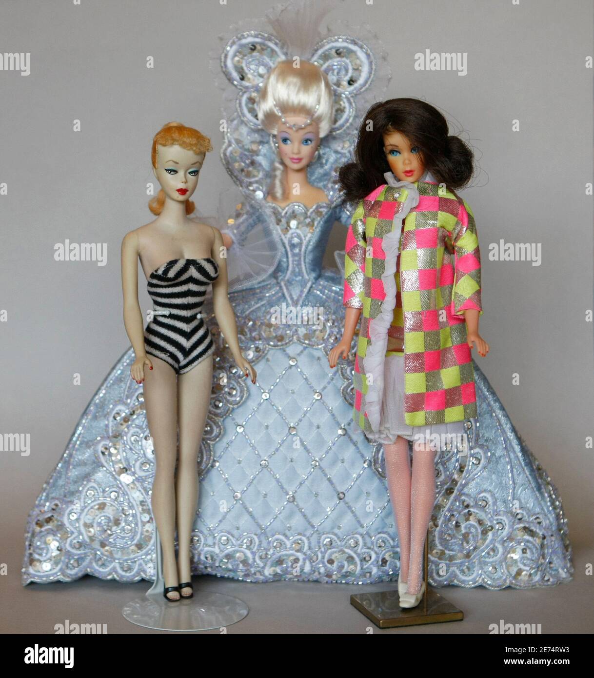 Barbie doll No.1 from 1959 (L), a Barbie doll of the 90s (C) and of the 60s  are pictured in Duesseldorf February 3, 2009. Bettina Dorfmann owns more  than 6,000 Barbie dolls
