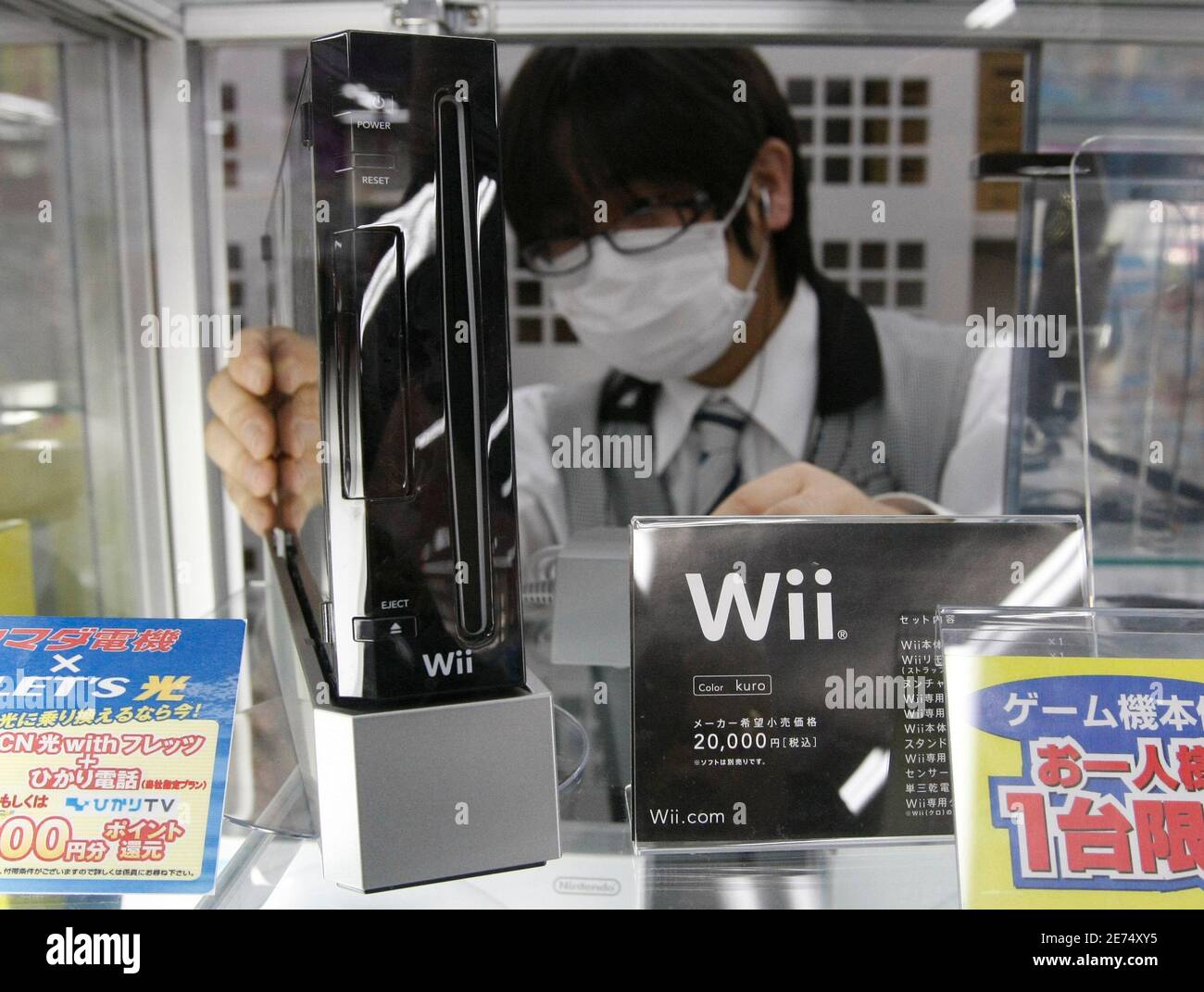 An Employee Arranges Nintendo Co S Wii Game Console At A Yamada Denki Electronics Retail Store In Tokyo January 5 10 Japan S Nintendo Co Ltd Said Sales Of Its Wii Video Game Console