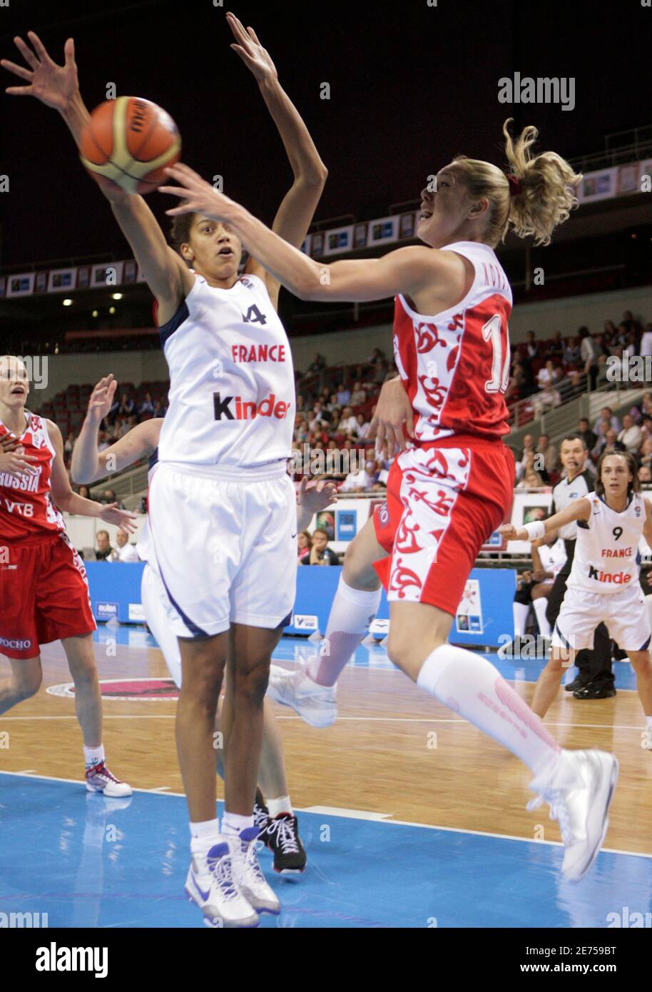 Russia's Ilona Kostin (R) fights for ball with France's Emmeline Ndongue  during their women's basketball European Championship qualifying round game  in Riga June 16, 2009. REUTERS/Ints Kalnins (LATVIA SPORT BASKETBALL Stock  Photo -