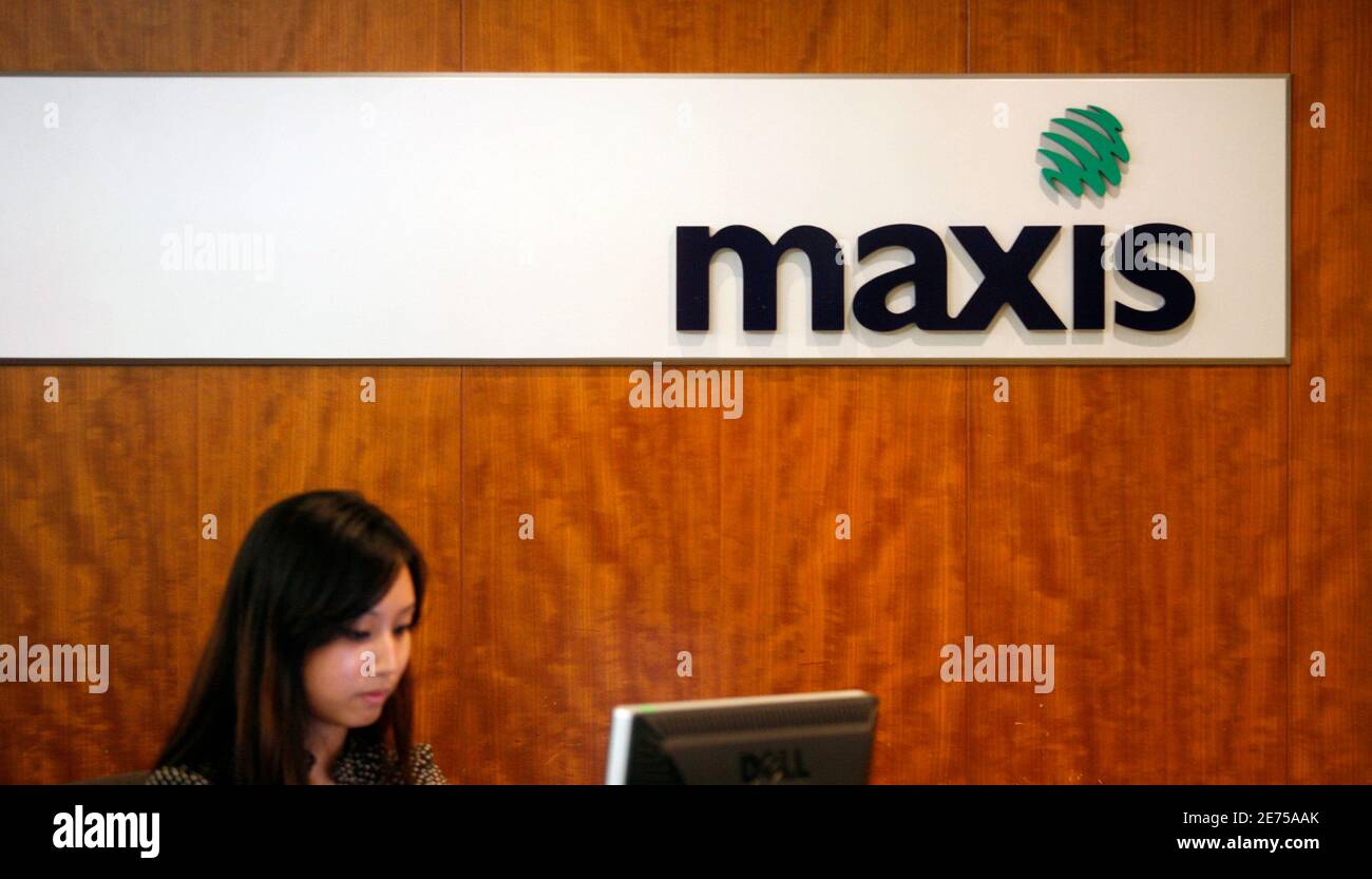 Maxis logo is on display behind a counter at its headquarters in Kuala  Lumpur November 18, 2009. With many local institutions squeezed out of its  IPO allocations, Maxis Bhd, Malaysia's top mobile