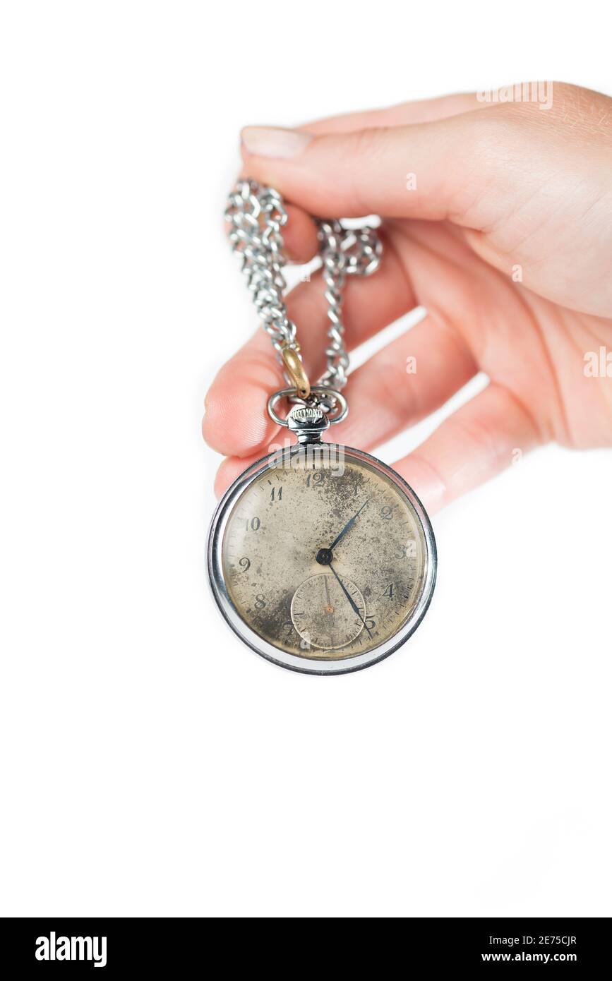 Hand holding a retro styled pocket chain watch Stock Photo