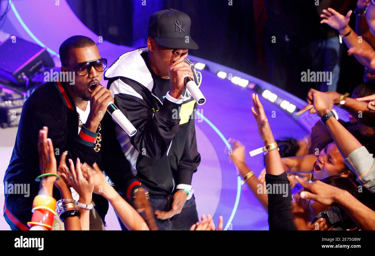 Entertainer Kanye West performs with Shawn "Jay-Z" Carter (R) at a taping  of the BET Channel's show "106th and Park" on the day that both West and  rival 50 Cent release their