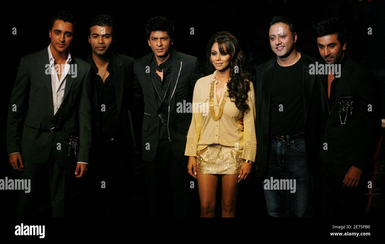 Bollywood actor Shah Rukh Khan (3rd L) his wife Gauri (3rd R), pose along with actors Ranbir Kapoor (R), Imraan Khan (L), Indian film director Karan Johar (2nd L) and designer Varun Bahl during a fashion show on the final day of India Couture Week in Mumbai October 16, 2009. REUTERS/Punit Paranjpe (INDIA ENTERTAINMENT FASHION) Stock Photo